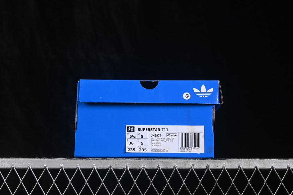 Blue adidas shoe box labeled Superstar II J, style JH9977, with a size 38 label.