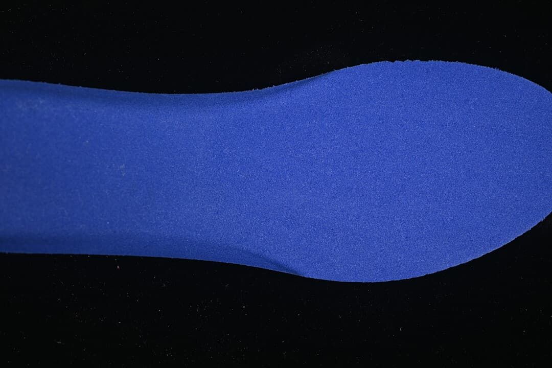 Blue insole shown separately against a dark background