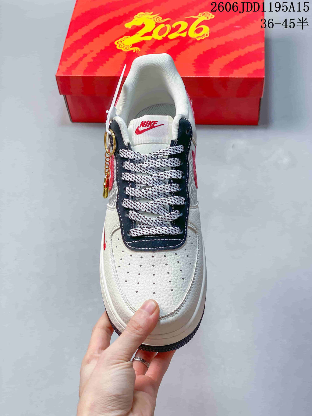 Top view of the Nike Air Force 1 Low showing its perforated toe, patterned laces and navy lace panel