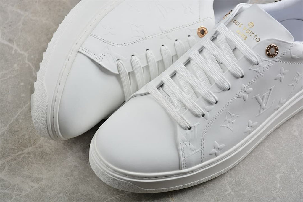 Close-up of the white embossed upper and lace-up toe