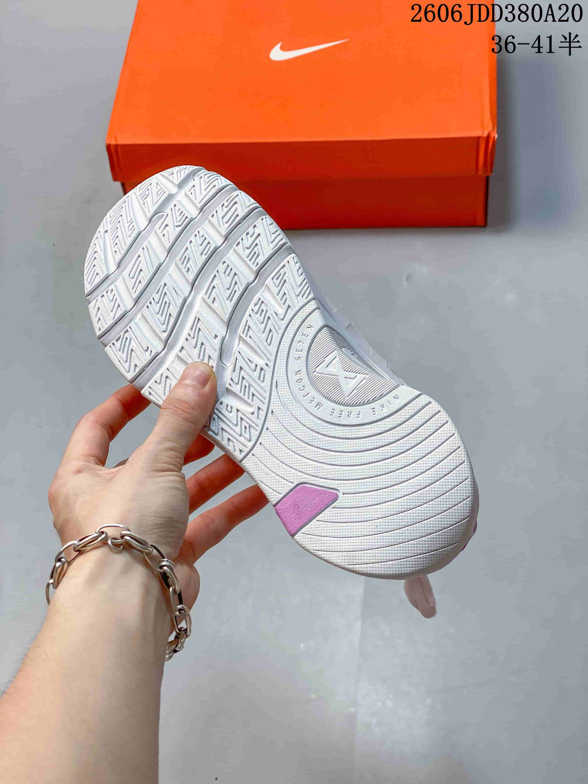 Close-up of the patterned outsole on a white Nike Free Metcon 7 shoe
