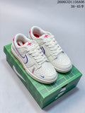 Pair of off-white Nike Dunk low-top sneakers with red and blue details, shown on a green football-themed box.