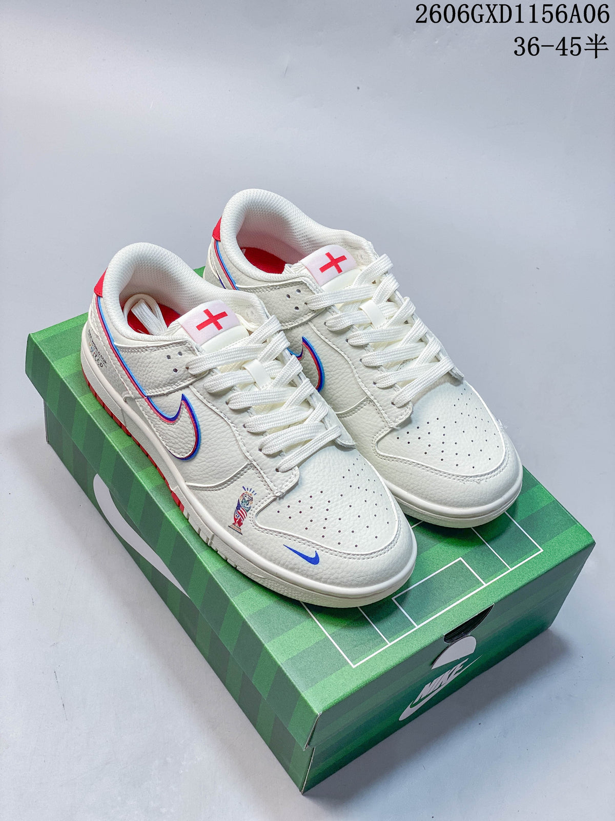 Pair of off-white Nike Dunk low-top sneakers with red and blue details, shown on a green football-themed box.