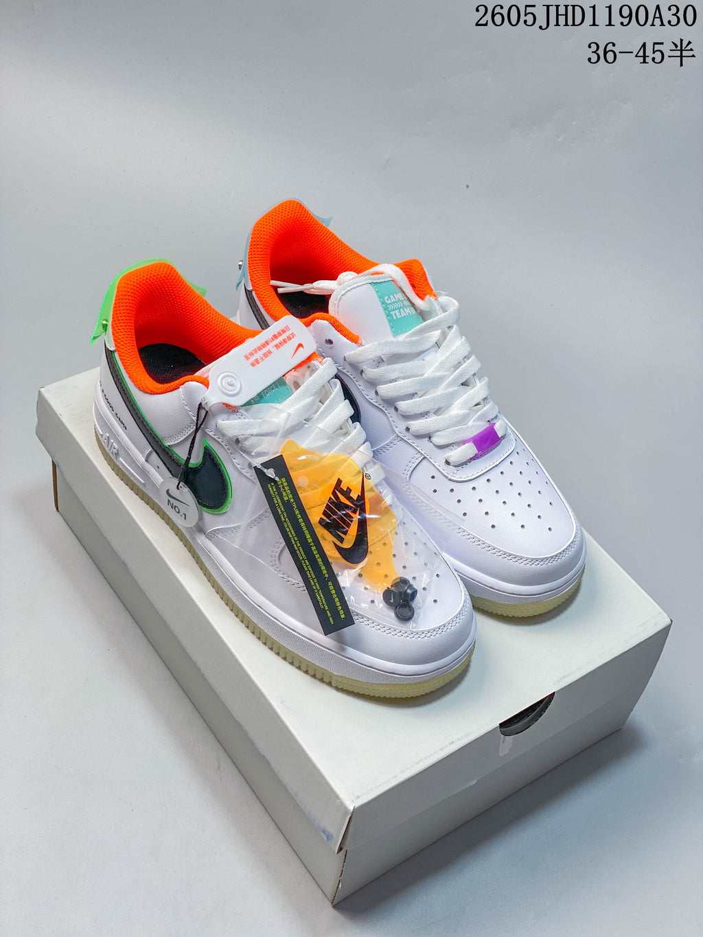 Pair of white Nike Air Force 1 ’07 LV8 sneakers with dark patterned side panels, green trim, orange lining, purple lace accents, and translucent pale-yellow soles