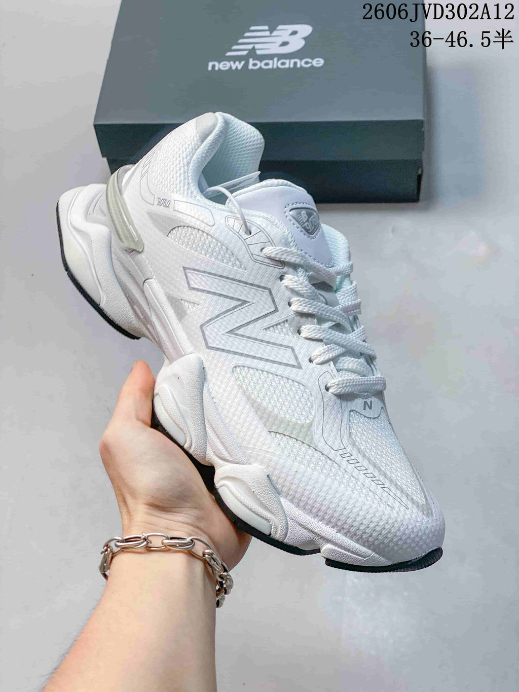 Angled side view showing the New Balance logo, layered upper, and sculpted sole.