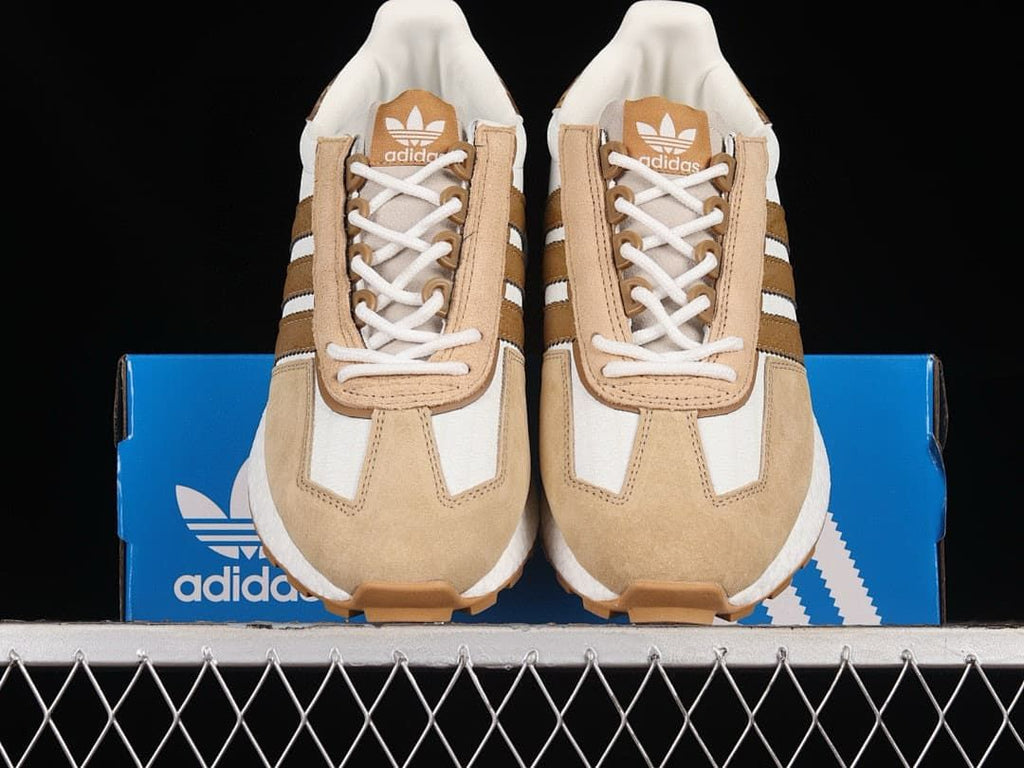 Front view of the pair showing laces, beige overlays, and brown stripes