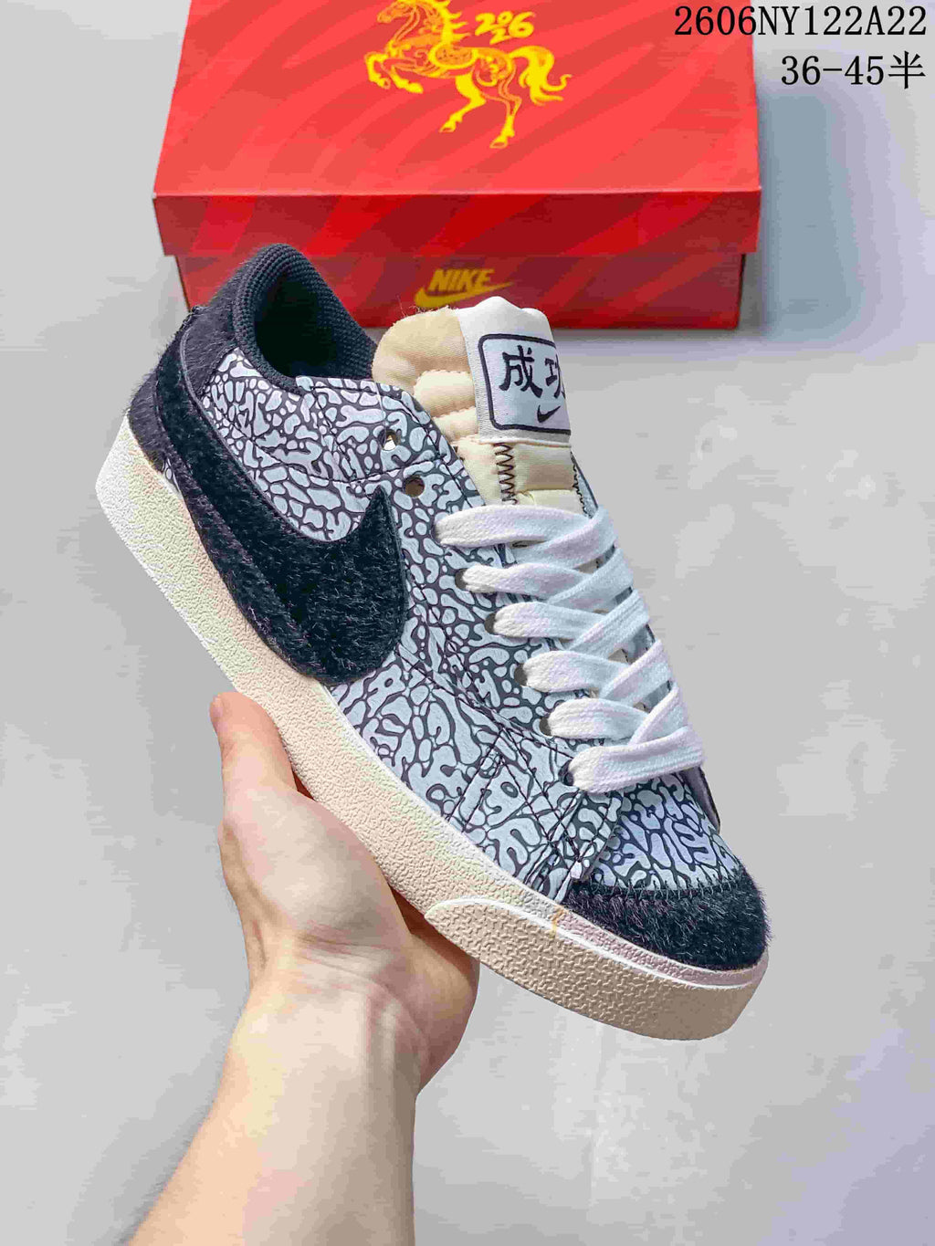 Close-up of a black-and-white patterned sneaker with dark Swoosh panel