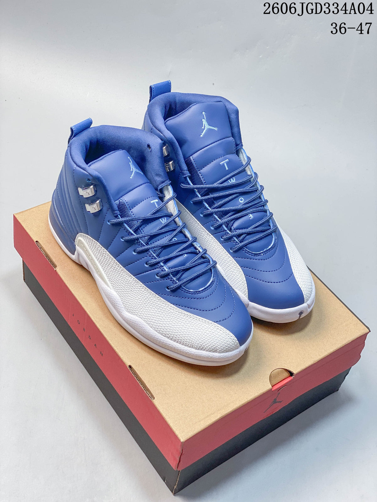 Pair of blue and white Jordan Air Jordan 12 high-top shoes displayed on a shoebox