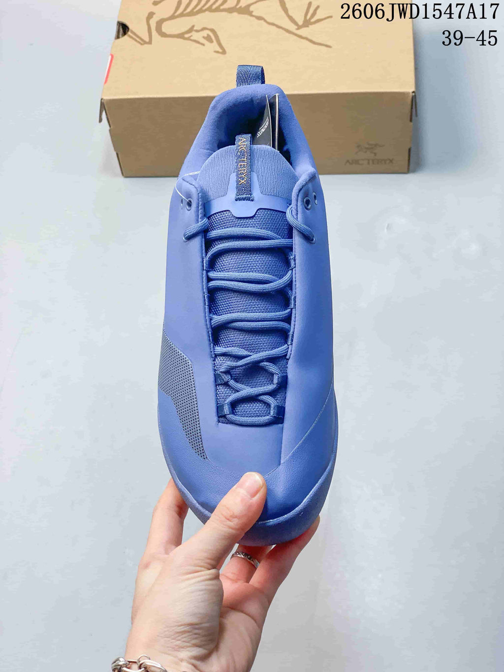 Top view of the blue shoe showing its lace-up front and tongue