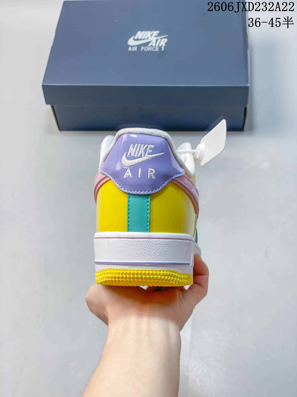Rear view of the sneaker with a multicolor heel and white midsole