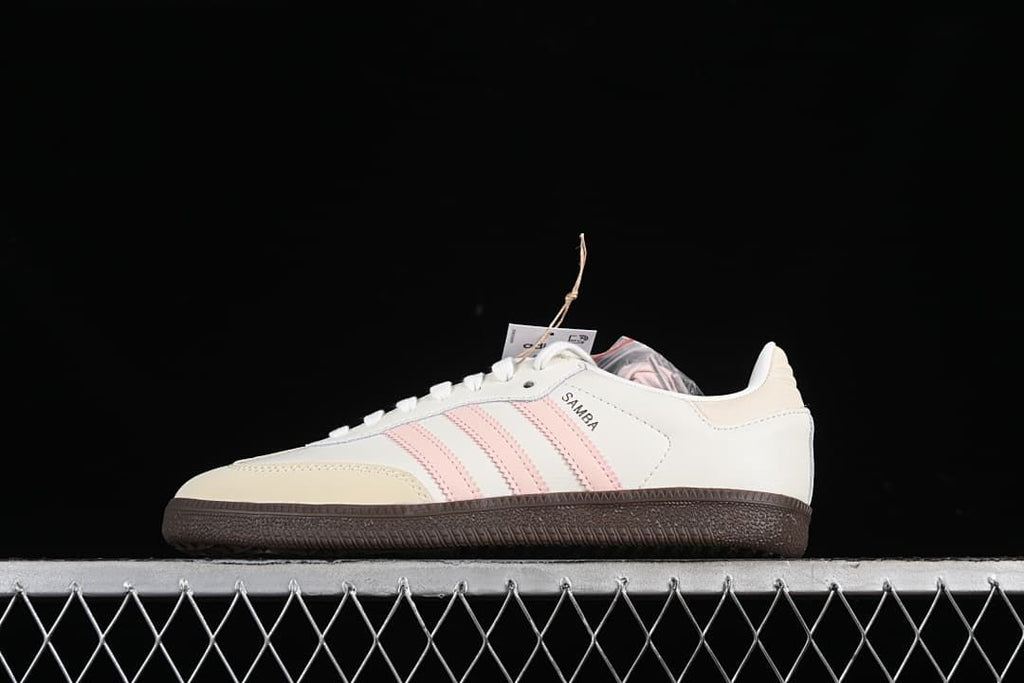 Side view of the off-white and pale pink Samba sneaker