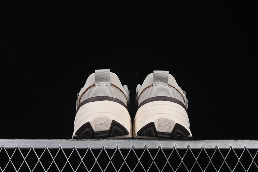Rear view of both sneakers showing heel details