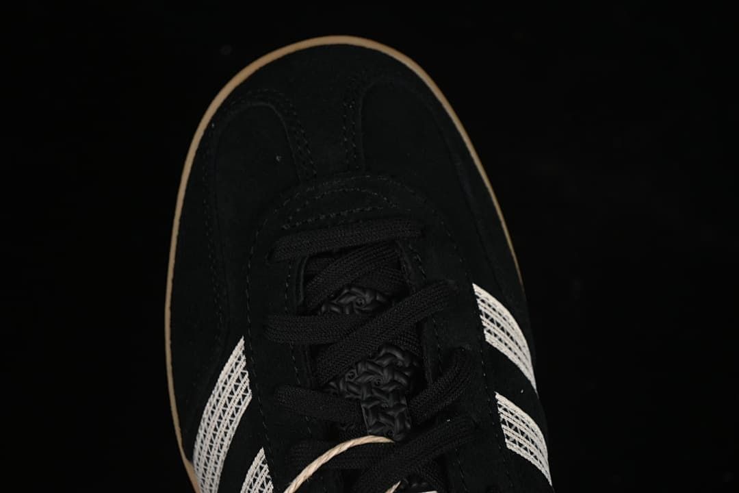 Top view of the sneaker toe, laces and side stripes.