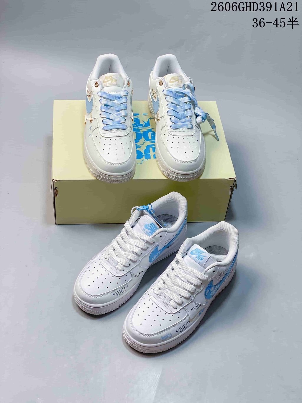 Two pairs of white low-top sneakers shown with light-blue accents and contrasting lace and charm details.