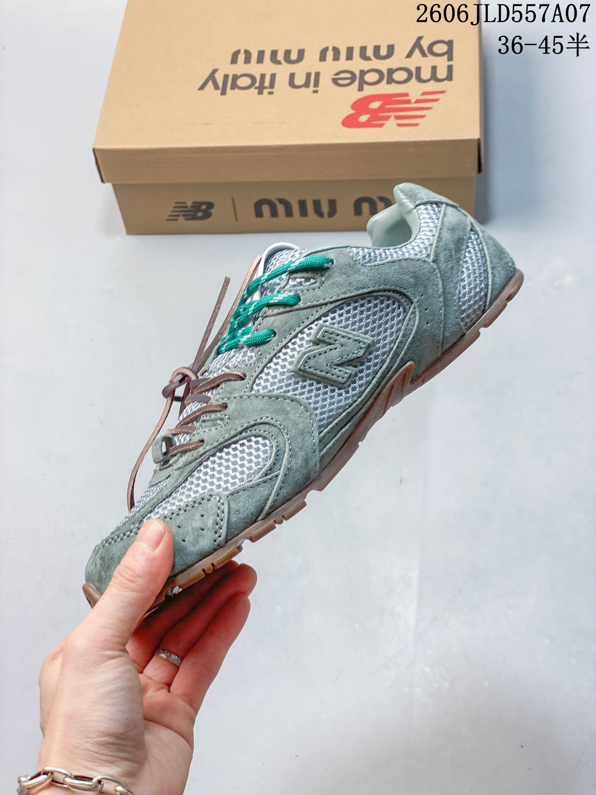 Side view of the sage-green and silver low-top sneaker with layered panels and contrasting laces