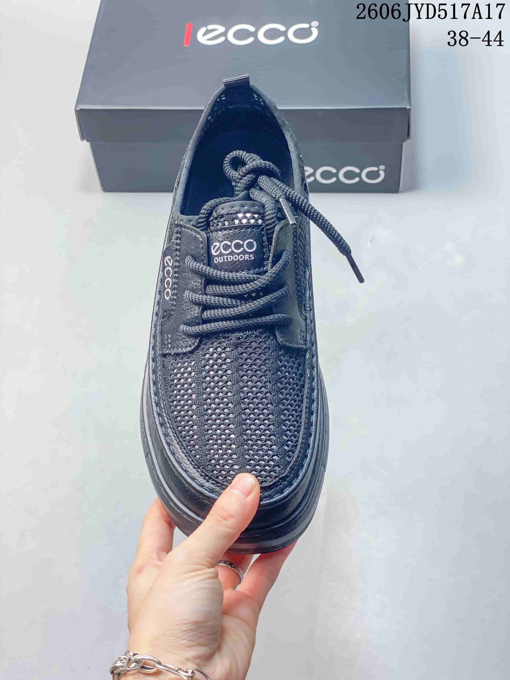 Top view of a dark gray ECCO lace-up sneaker with mesh-look toe panel; image text states sizes 38–44.