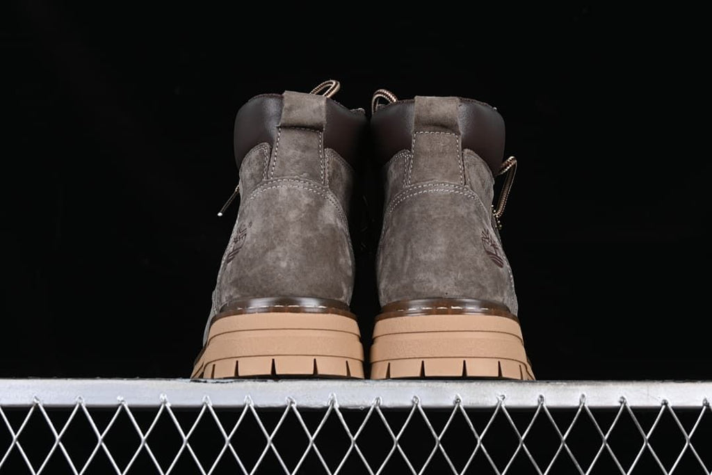 Rear view of the pair of boots and their tan soles.