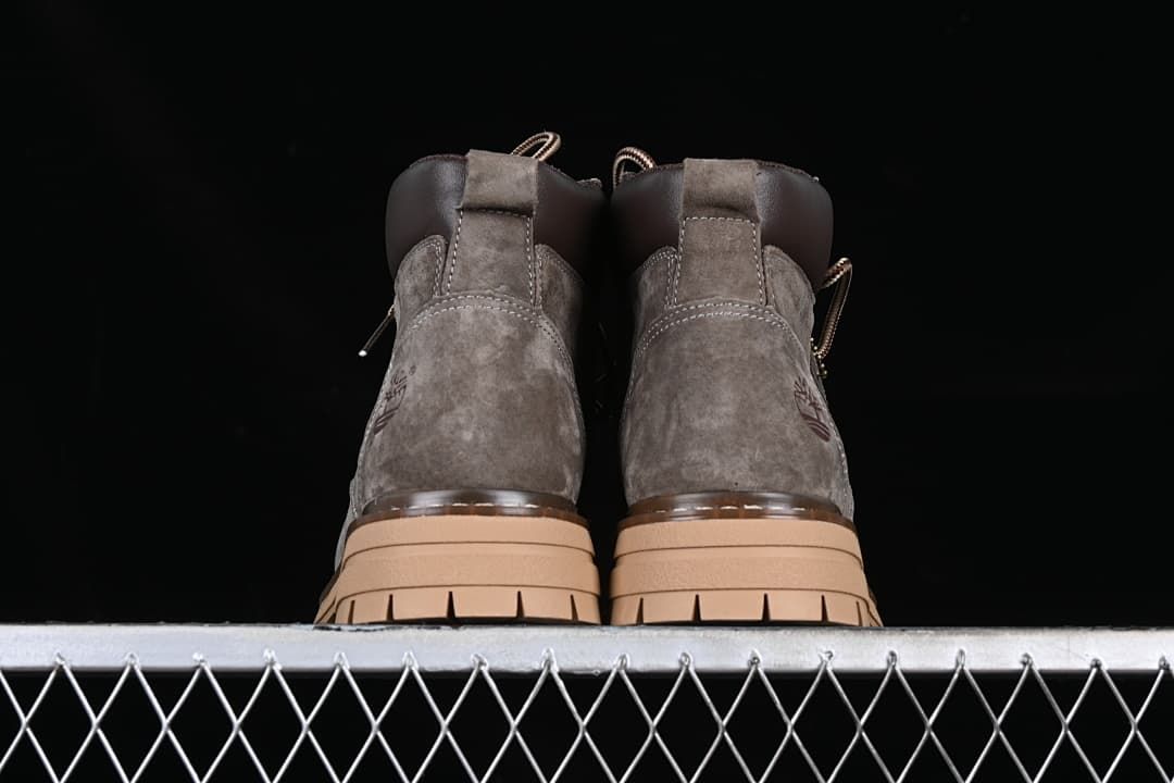Rear view of the pair of boots and their tan soles.