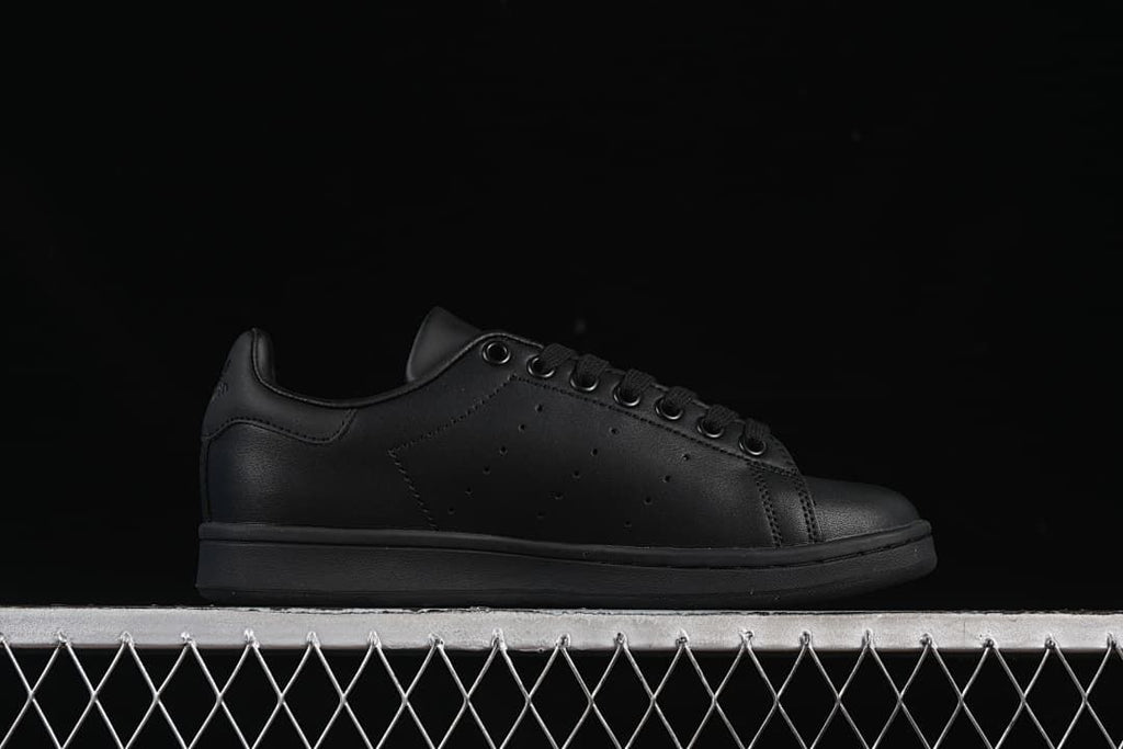 Side profile of the black low-top sneaker