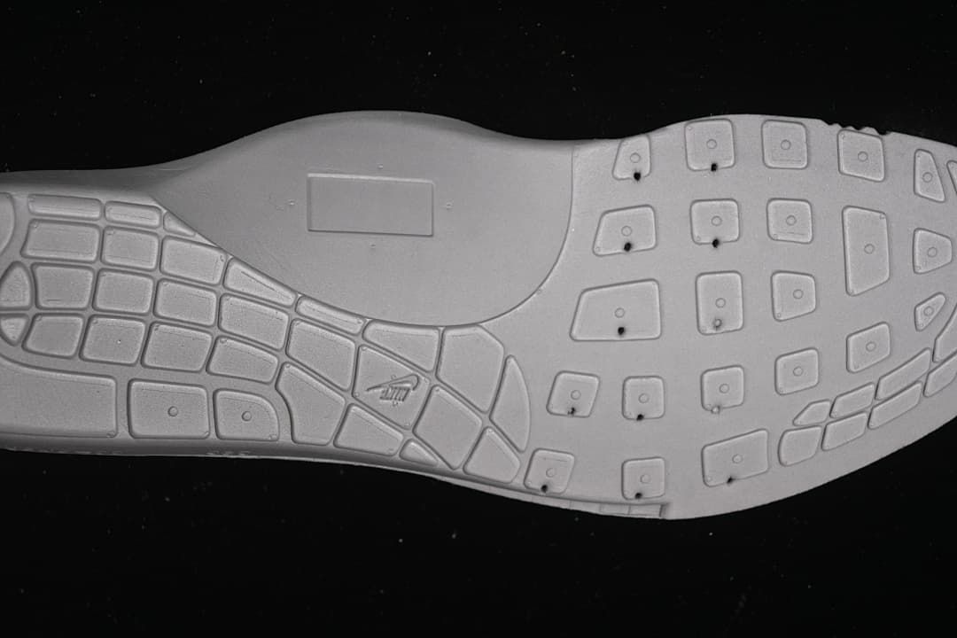 Outsole view showing the patterned tread of the sneaker.
