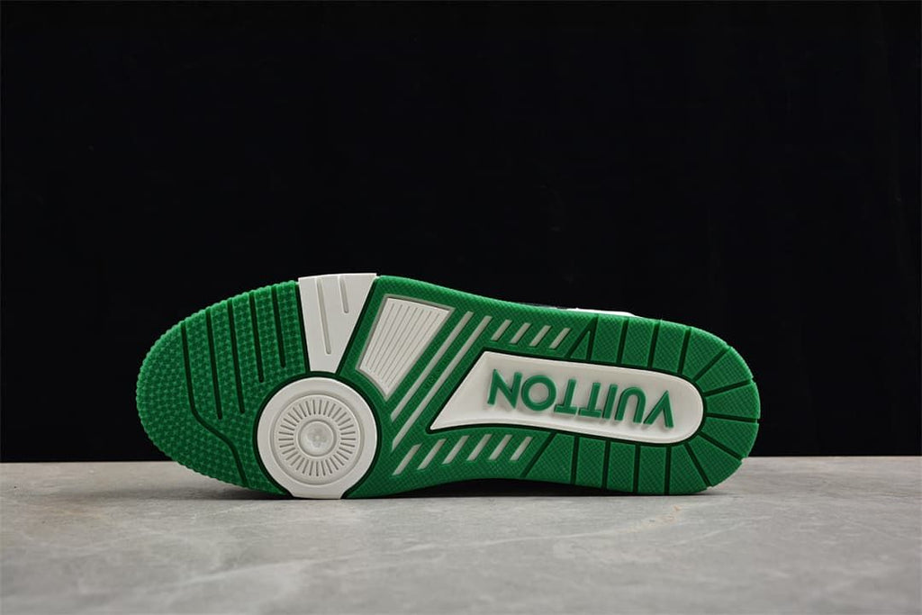 Underside of the sneaker showing the green and white outsole pattern.