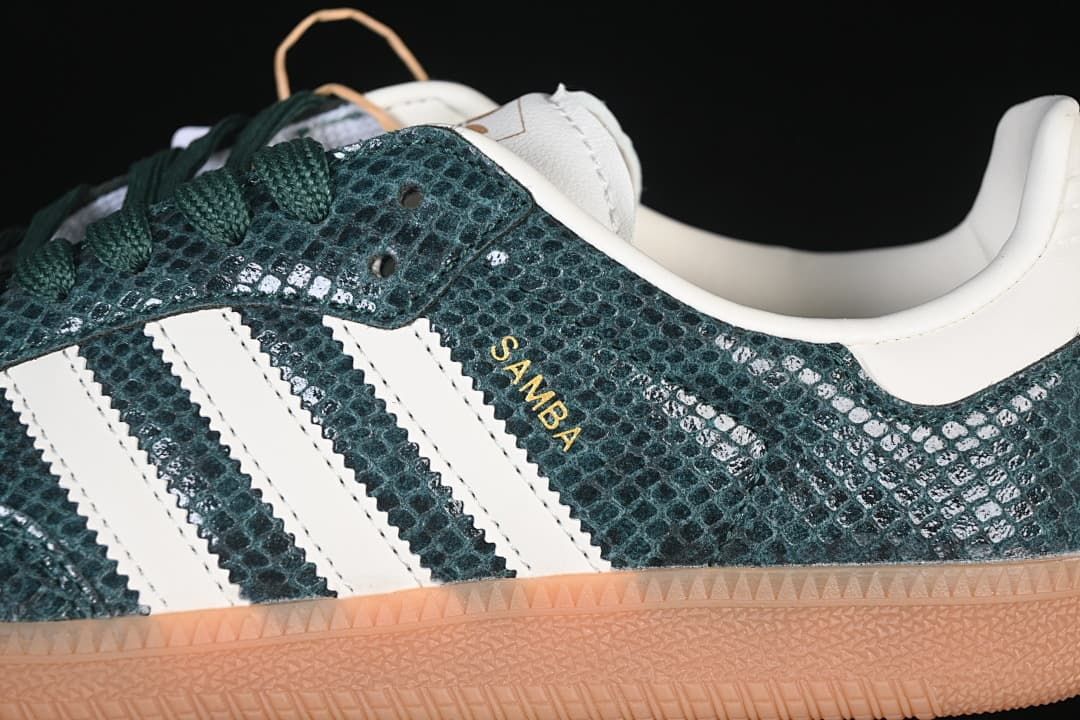 Close-up of green textured upper, white stripes, and gold Samba lettering