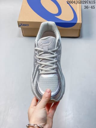 Top view showing the laces, tongue, mesh toe box, and white and silver color blocking.