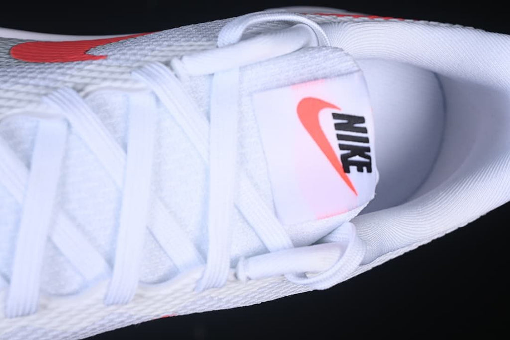 Top detail of the white laces, tongue, and collar