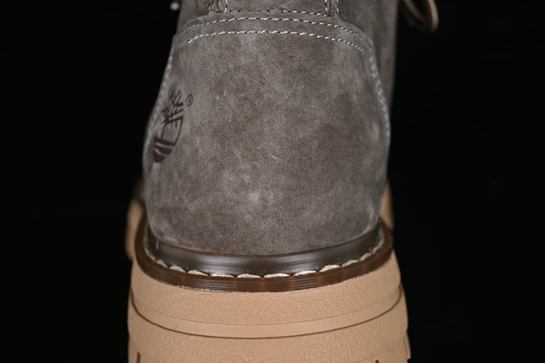 Rear detail of the gray boot, stitching and tan sole.