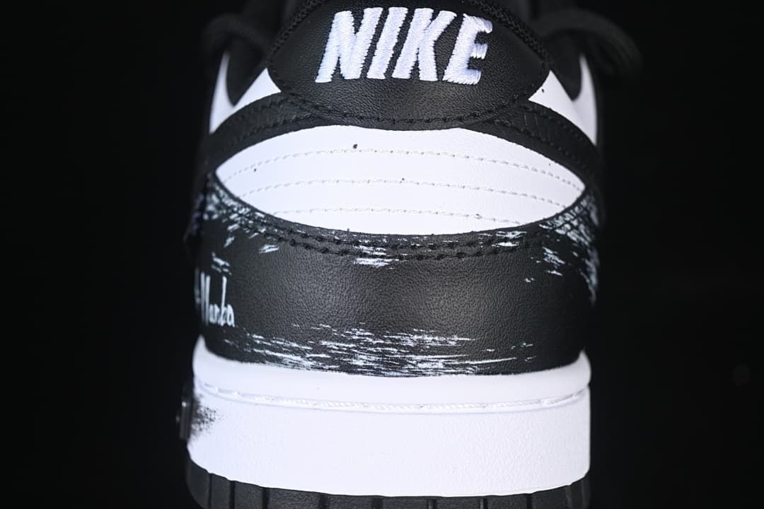 Rear view showing the black and white heel and brushstroke graphics