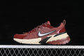 Side view of burgundy Nike V2K Run sneakers with a light-colored midsole