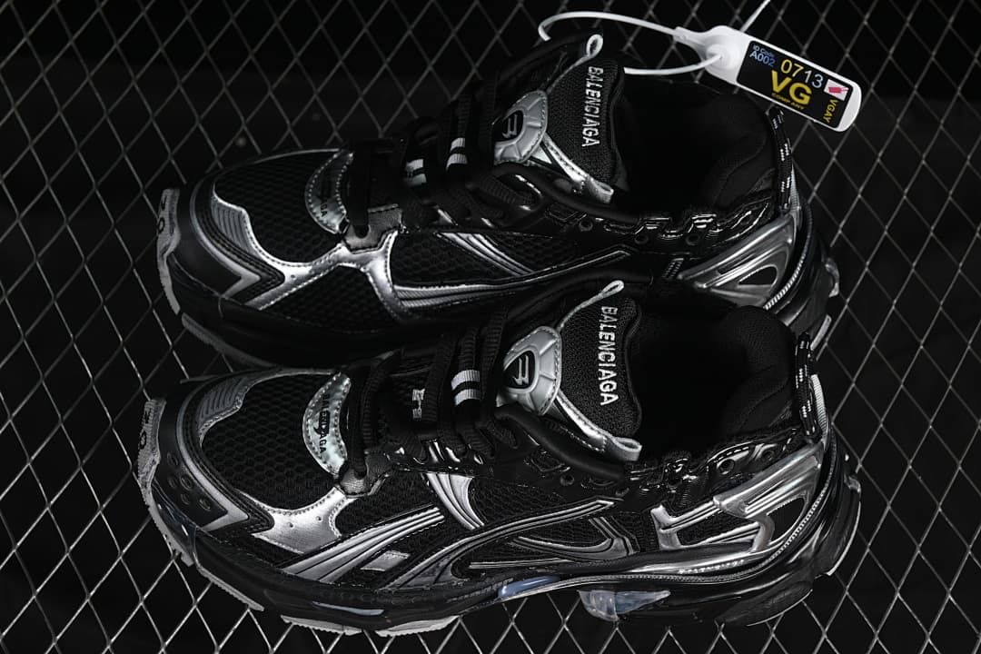 Pair of black and silver sneakers shown from above at an angle.