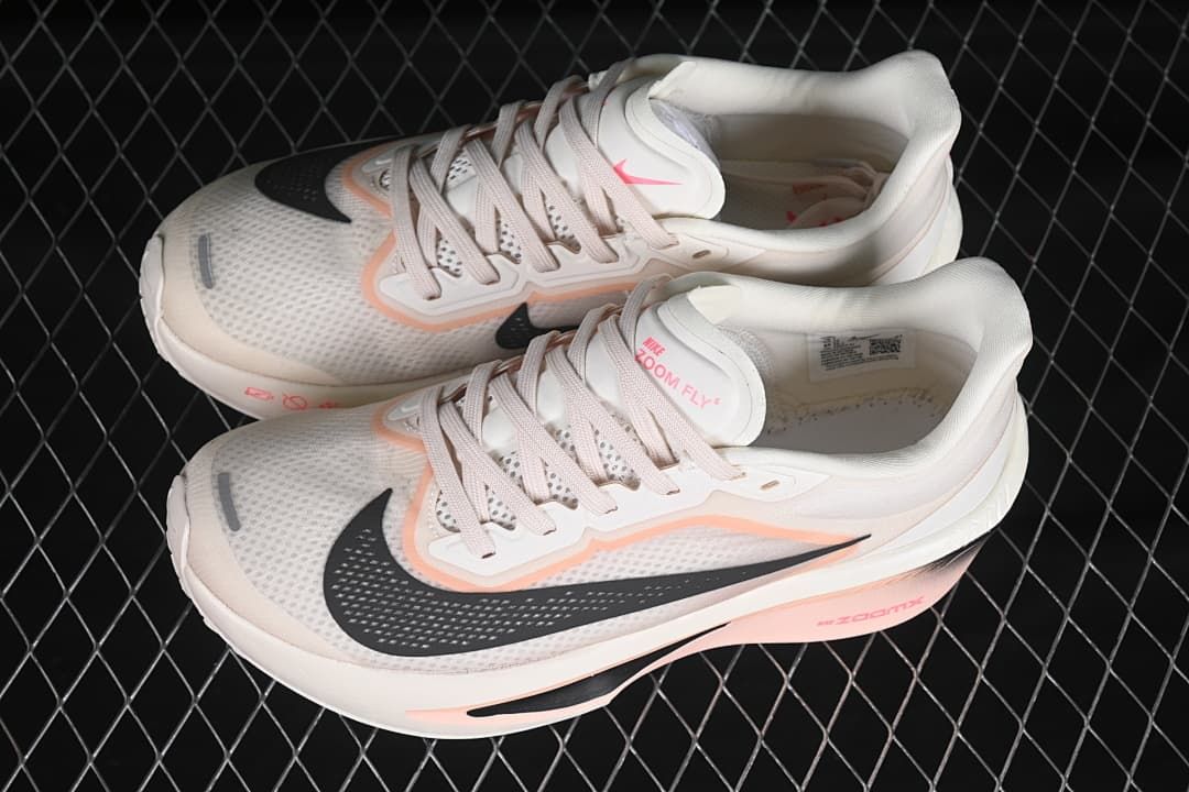 Pair of white and pink Nike Zoom Fly 6 shoes shown from above