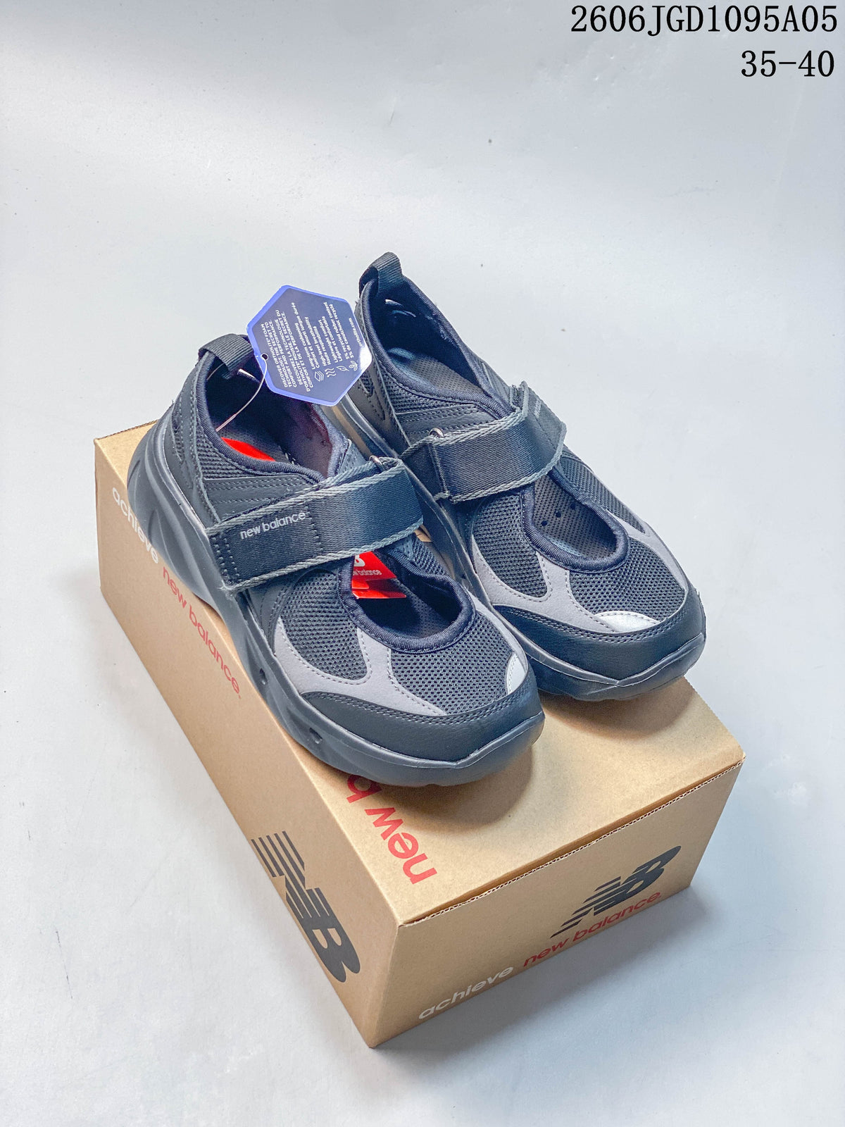 Pair of dark gray New Balance Breeze Mary Jane sneakers with hook-and-loop straps