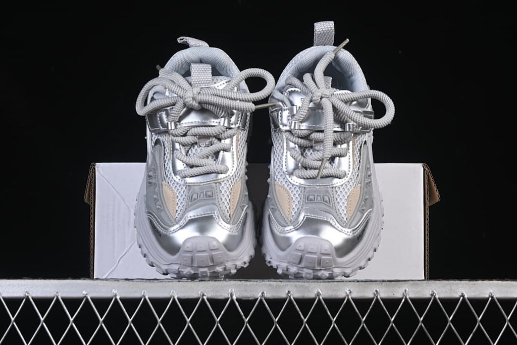 Front view of the pair of silver and light gray sneakers