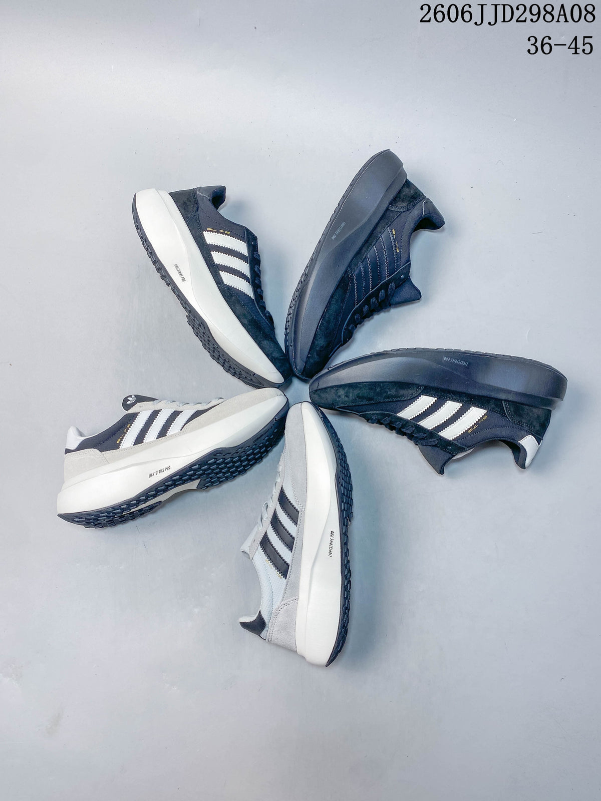 Several adidas SL 72 Pro sneakers arranged in different navy and grey color combinations