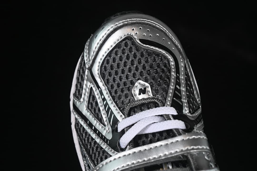 Top-front close-up showing the mesh-look toe, silver overlays, and white laces