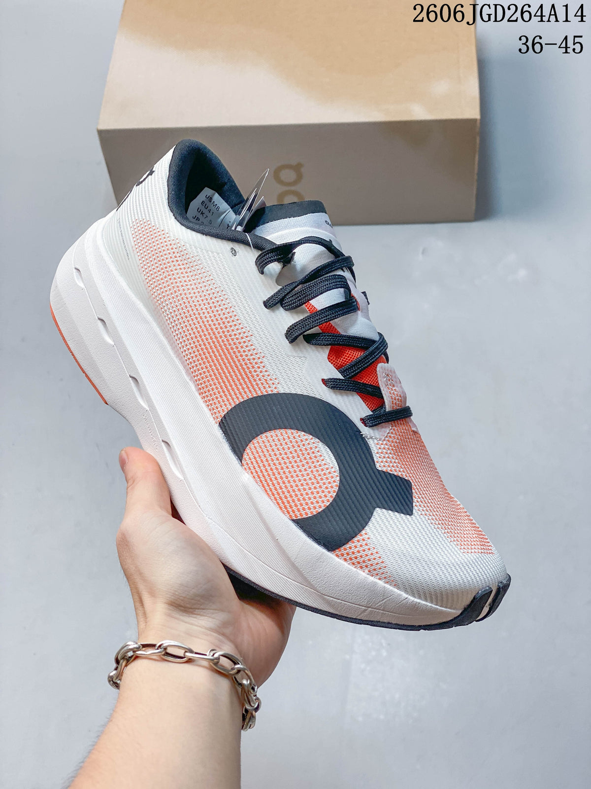 Angled side view of an On Cloudboom Volt running shoe in ivory white with coral accents