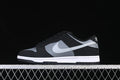 Side view of black, grey, and white Nike SB Dunk Low sneakers