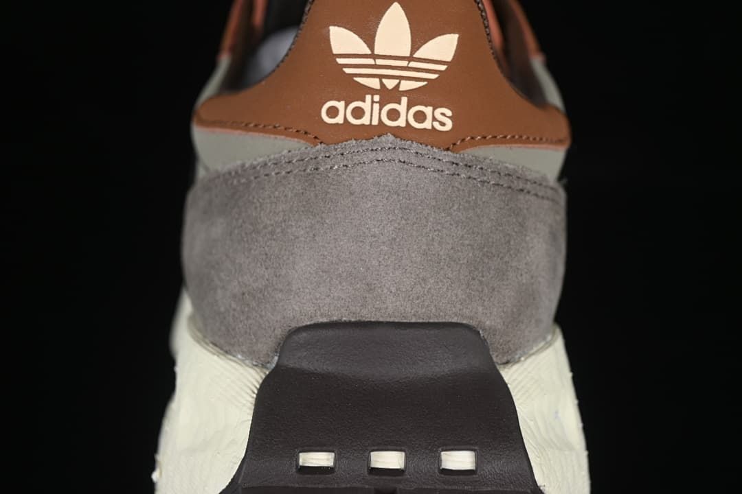 Rear view of the sneaker with brown heel tab and grey panels