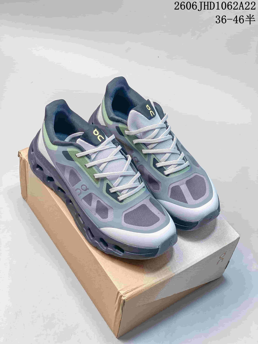 Gray On Cloudtilt Remix sneakers with green accents, shown as a pair.