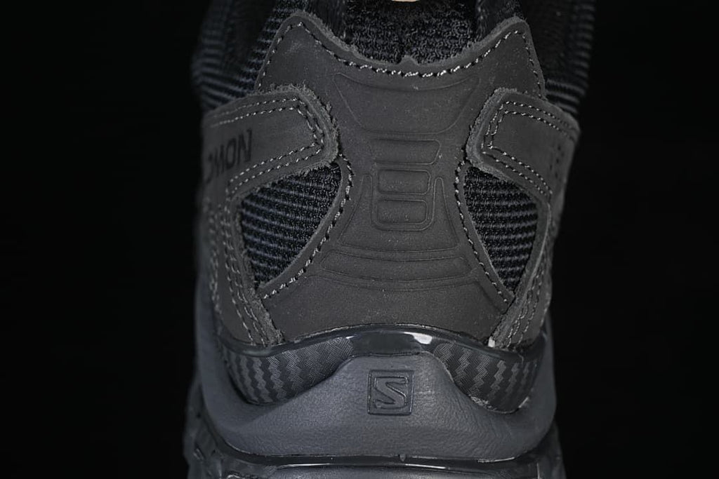 Rear view of the shoe showing its heel structure and overlays