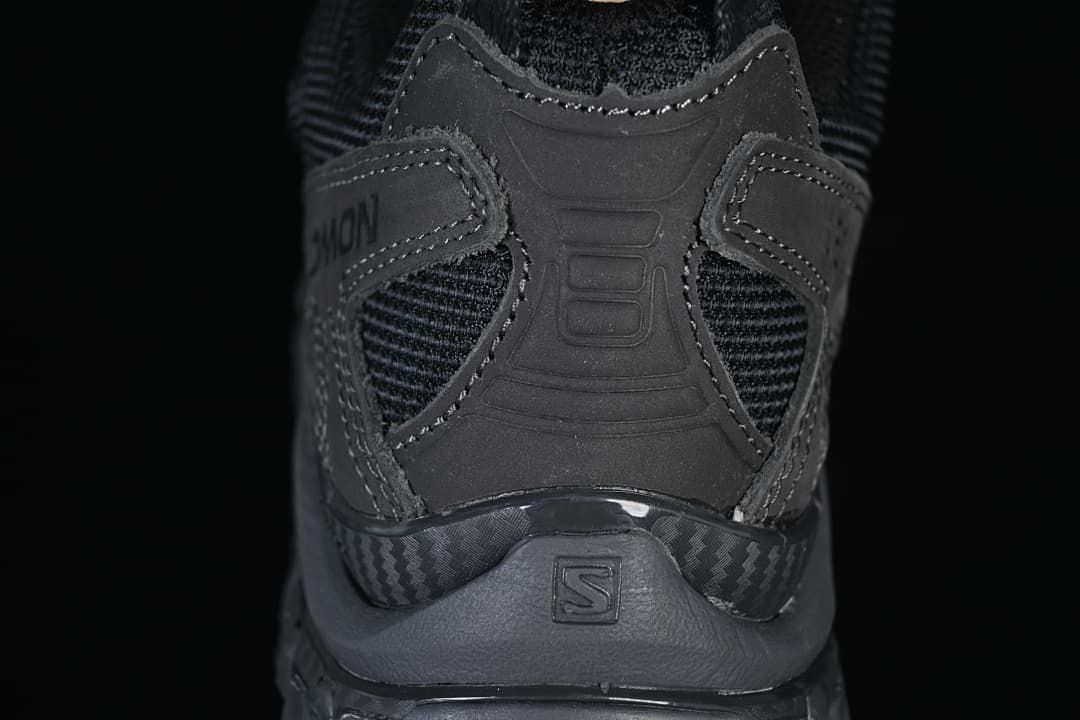 Rear view of the shoe showing its heel structure and overlays