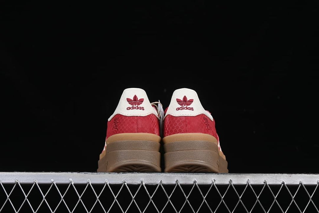 Rear view of the pair showing white heel tabs and raised soles