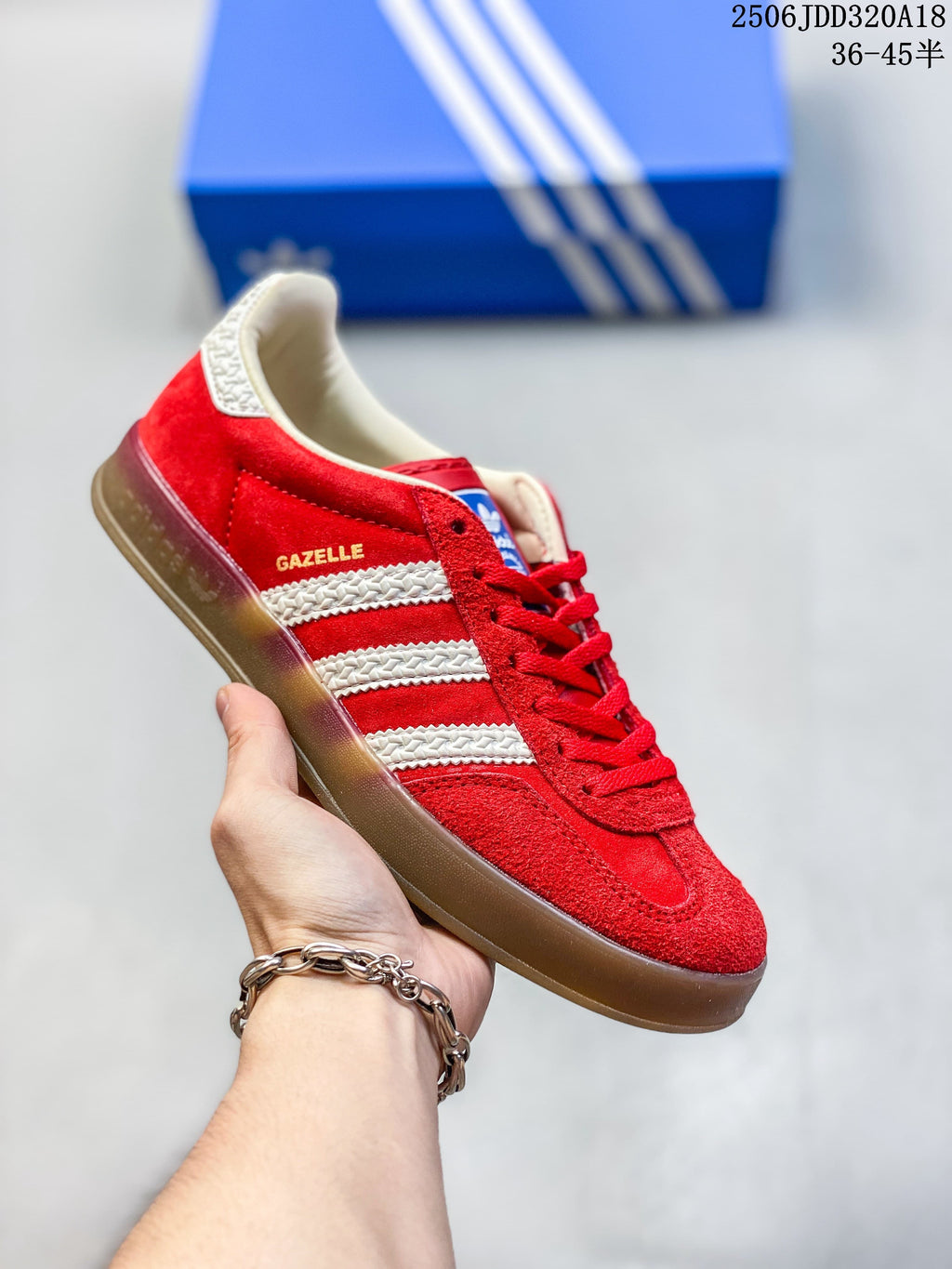 Red Adidas Gazelle low-top sneaker with white stripes and a gum-look sole