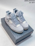 Pair of grey Air Jordan 4 Retro mid-top sneakers displayed on a patterned shoe box