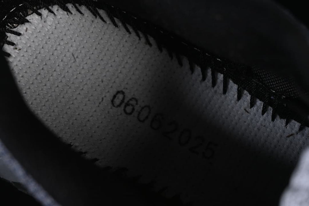 Close-up inside the shoe showing a printed production marking