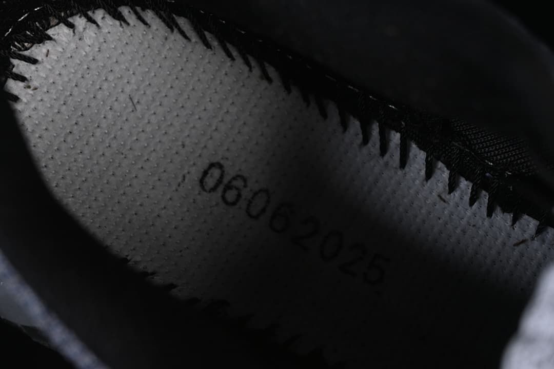 Close-up inside the shoe showing a printed production marking