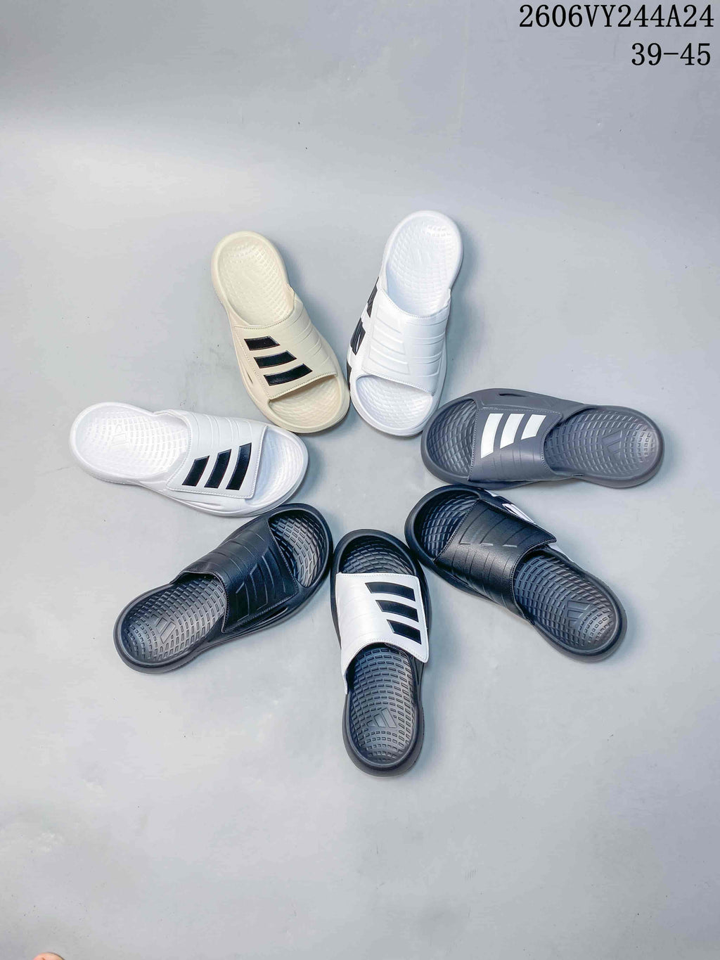 Group of adidas slides in several colors, including white, cream, gray, and dark navy; image overlay lists sizes 39–45.