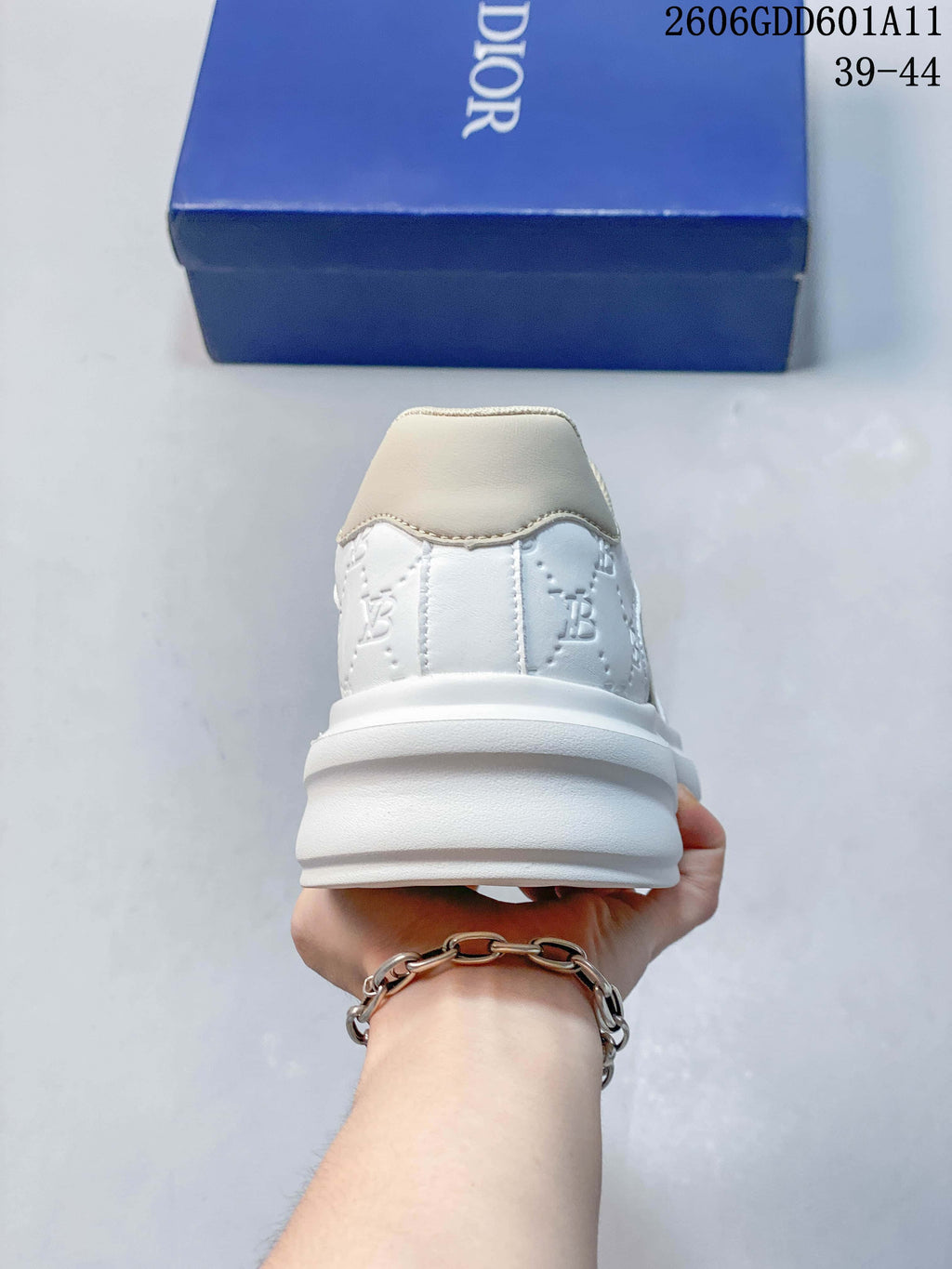 Rear view showing the white heel, embossed details, and thick sole.